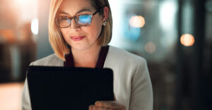 Small business owner using a digital platform powered by AI to explore personalized insurance options.