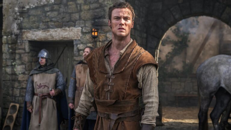 A dirt-covered Robin Hood stares into the distance