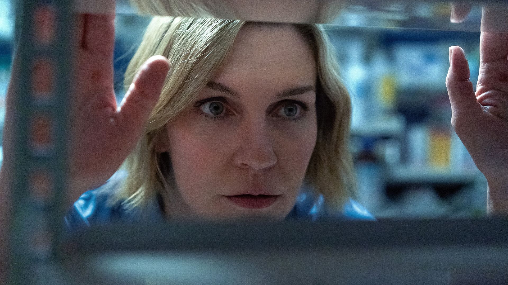 Carol peering through an empty shelf in Pluribus episode 4