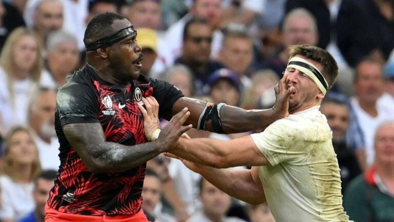 Tom Curry of England and Fiji's Levani Botia push each other in the face during their teams' 2023 Rugby World Cup quarterfinal