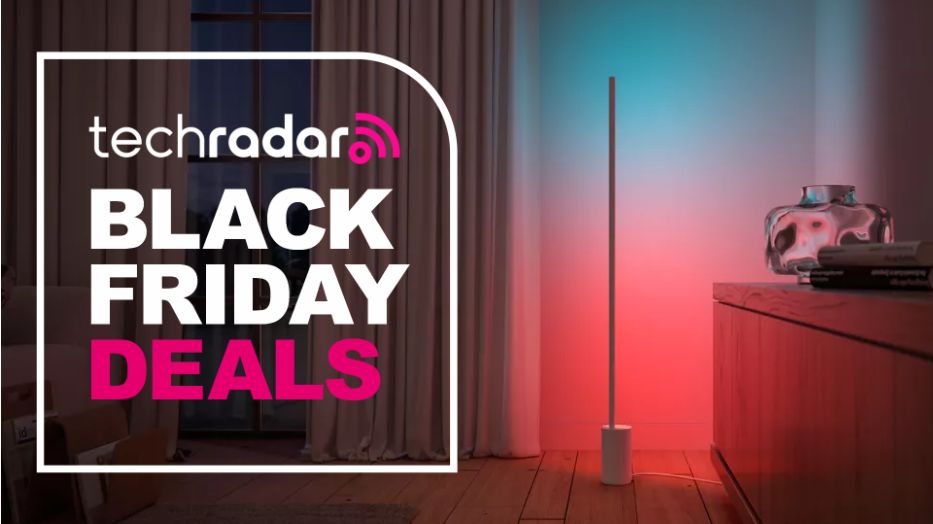 The Philips Hue Gradient Floor Lamp is lighting up a corner in a living room. To the left, a badge reads "Tech Radar Black Friday deals".