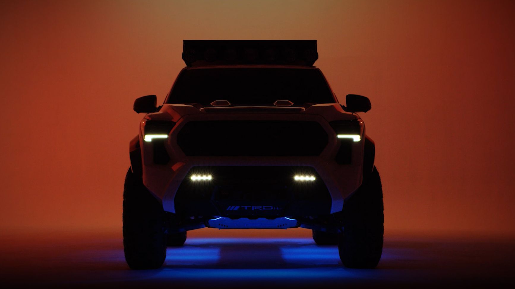 A Tacoma H2-Overlander truck in a studio