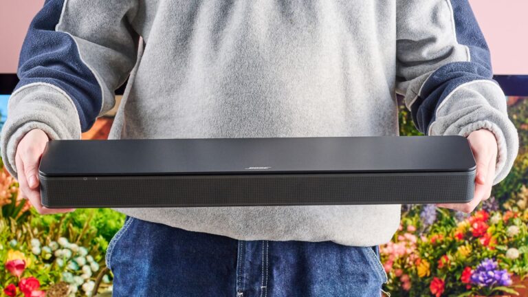 Man holding the Bose TV Speaker
