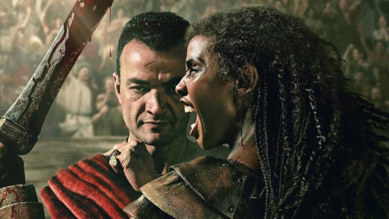 Ashur stands behind Achillia, who wields a bloody sword