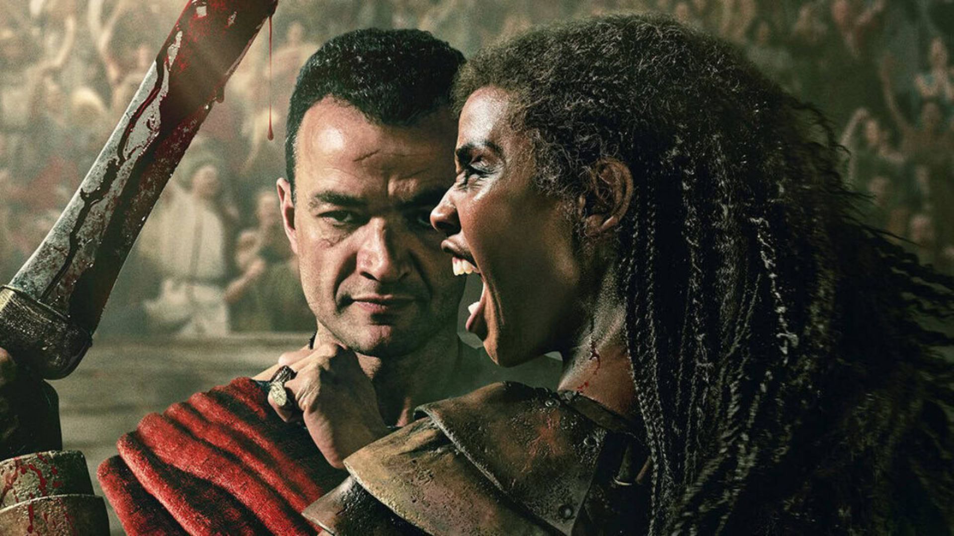 Ashur stands behind Achillia, who wields a bloody sword