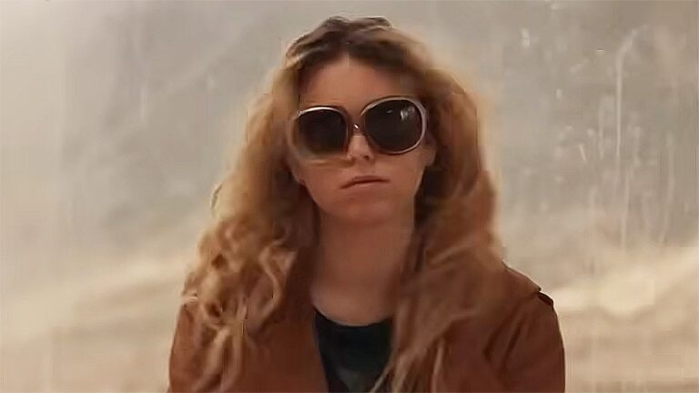 Milly Alcock's Kara Zor-El wearing a brown coat and sunglasses in 2026's Supergirl movie