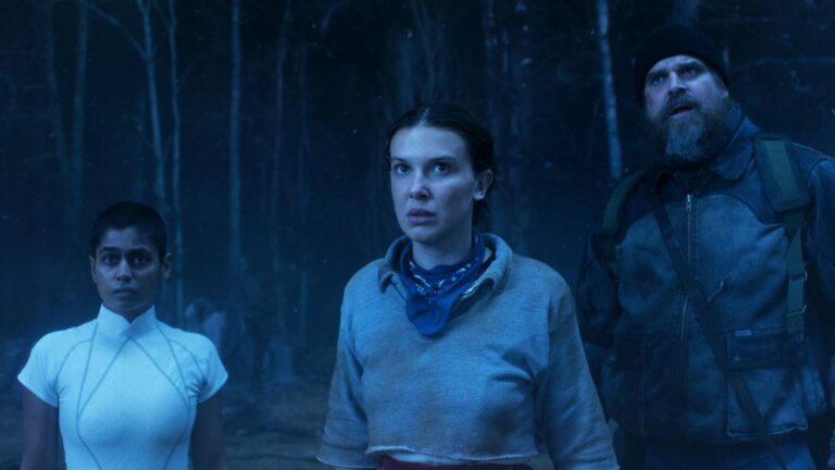 Kali, Eleven, and Hopper looking at something off-camera in the Upside Down in Stranger Things season 5