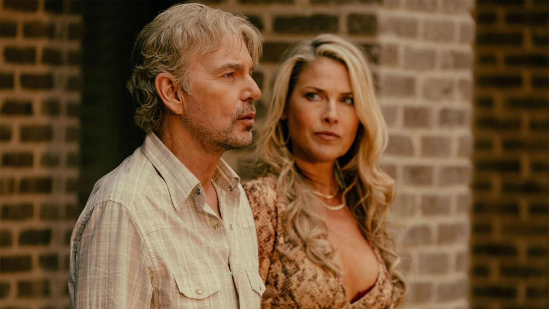 Angela looks at Tommy in the backyard