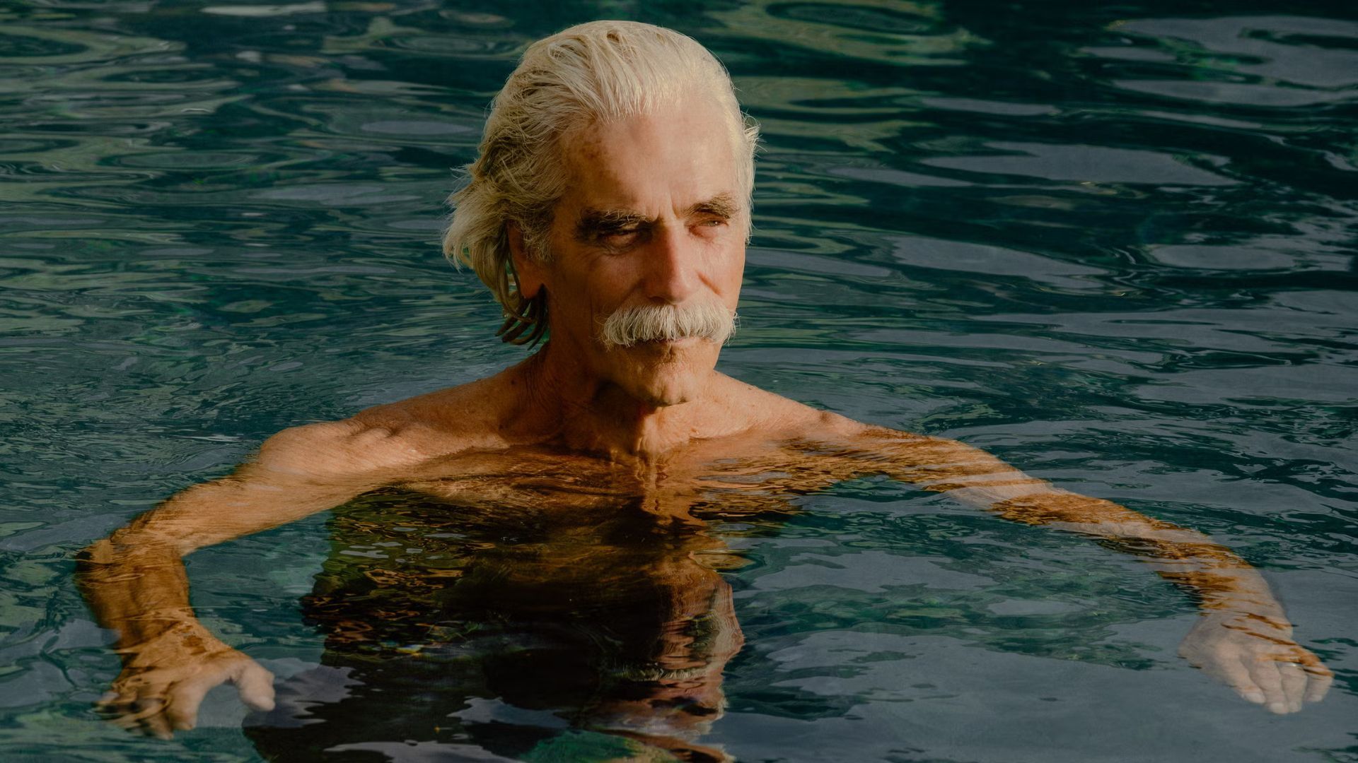 T.L. swims in a pool
