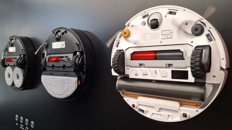 Roborock Saros 20, 20 Sonic and Qrevo Curv 2 robot vacuums flipped over to show mop system beneath