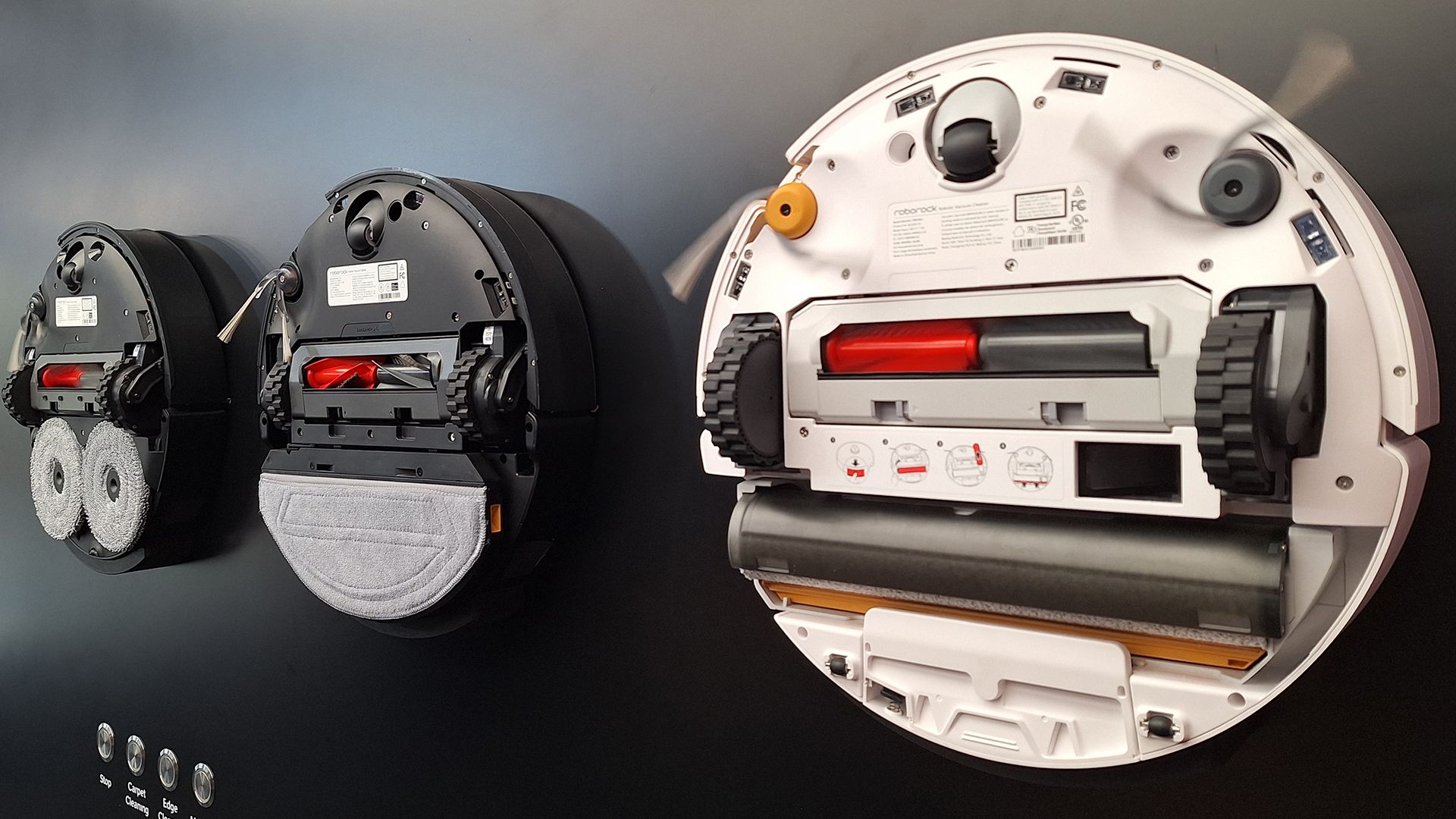 Roborock Saros 20, 20 Sonic and Qrevo Curv 2 robot vacuums flipped over to show mop system beneath