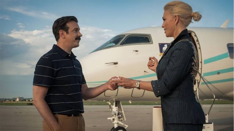 Ted and Rebecca looking at each other near to a private jet in Ted Lasso season 4