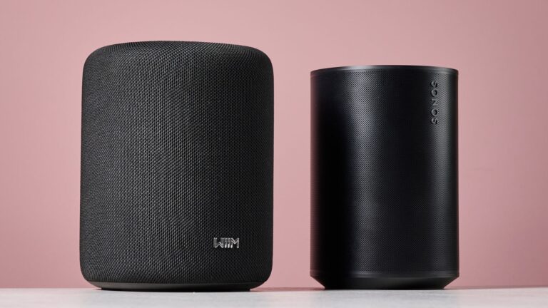 The WiiM Sound Lite side by side with the Sonos Era 100 from a 45 degree angle.