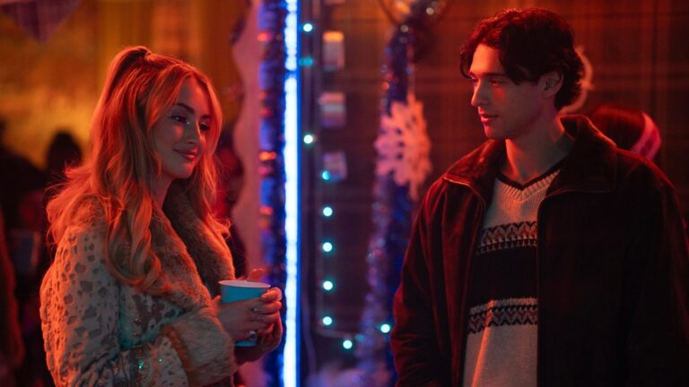 Lucy and Stephen talk at a party