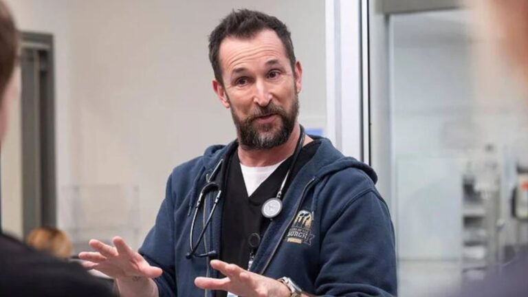 Dr. Robby talks to his team