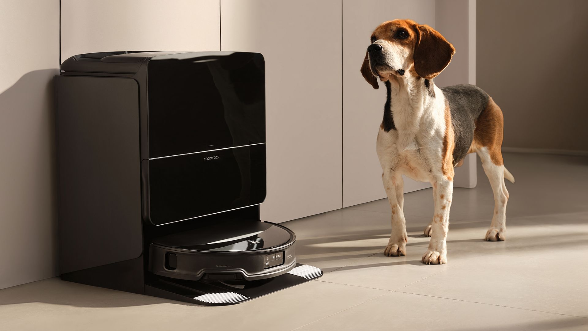 Roborock Saros 10R robot vacuum and mop in its dock with dog next to it