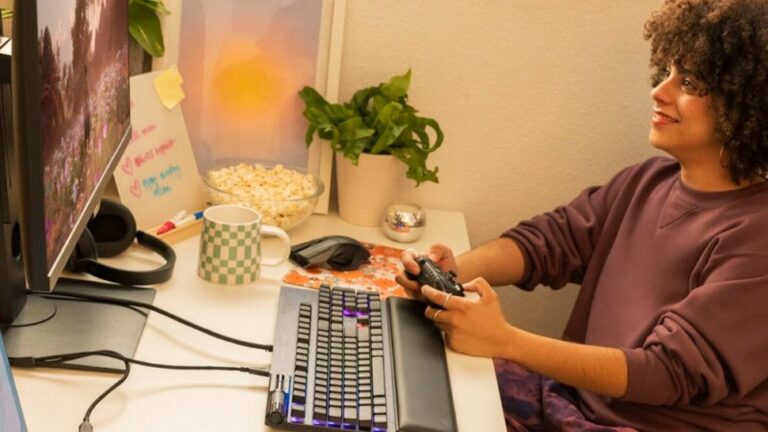 PC gamer using Xbox mode on a Windows 11 PC looking happy