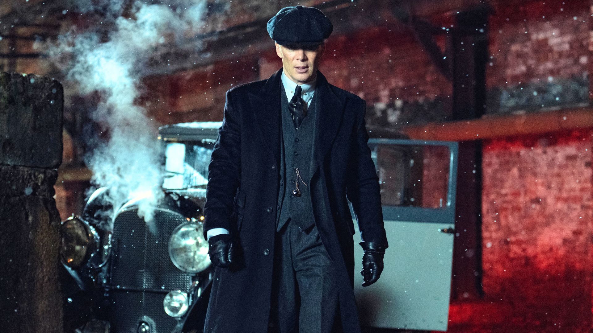 Tommy Shelby walks away from a car