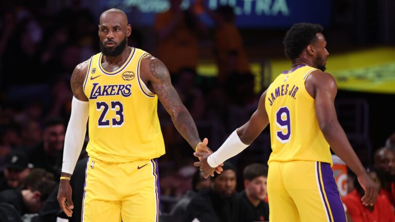 Los Angeles Lakers forward LeBron James is congratulated by his son and teammate Lakers guard Bronny James during a 2026 NBA Playoffs game.