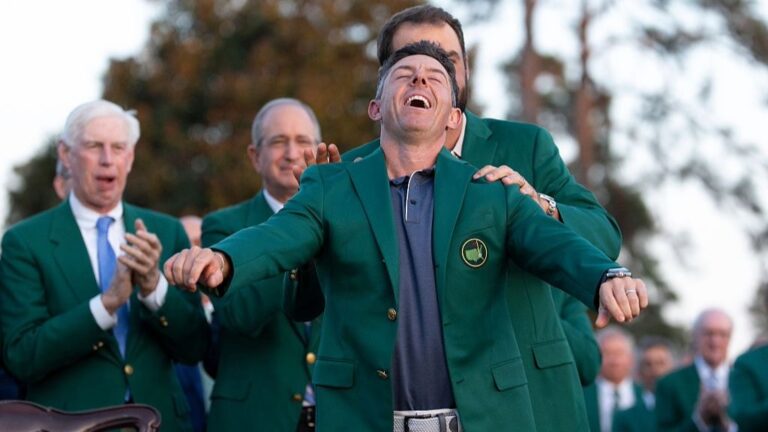 Rory McIlroy raises his head up to the sky after being presented with the Green Jacket for winning the Masters 2025