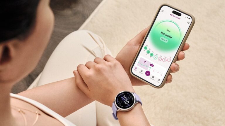 An iPhone and Garmin smartwatch showing a person's cycle tracking information.