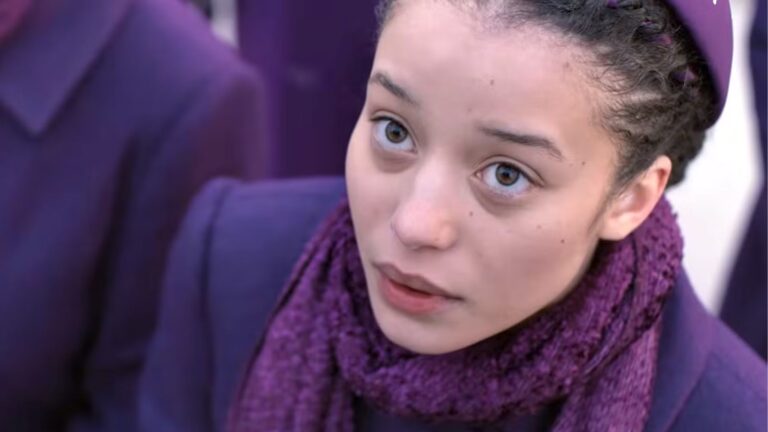 Agnes looks up at something offscreen