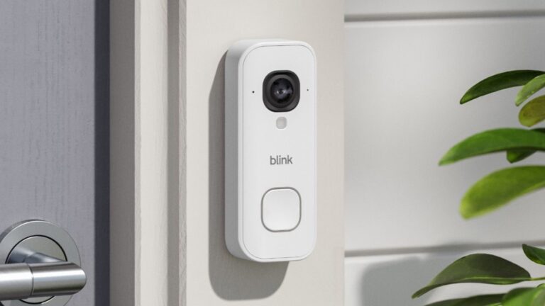 Blink Wired Video Doorbell 2K+ mounted on wall beside door