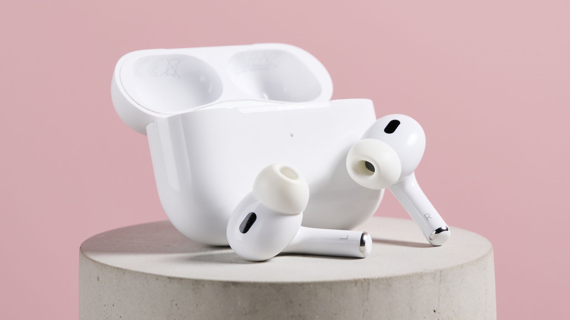 The AirPods Pro 2 earbuds next to their case