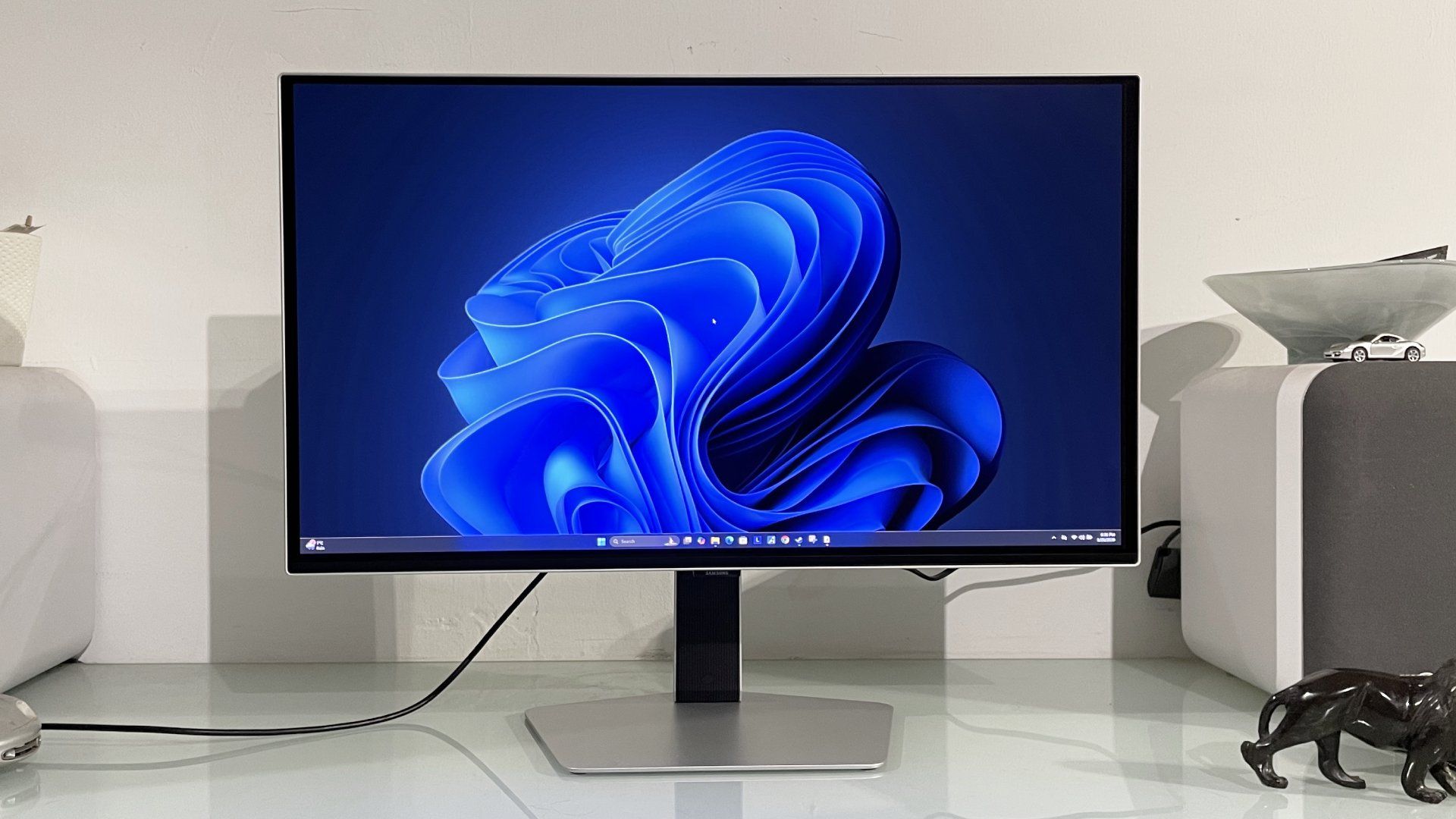 Samsung Odyssey OLED G6 G60SF monitor on a desk shown running Windows 11 desktop
