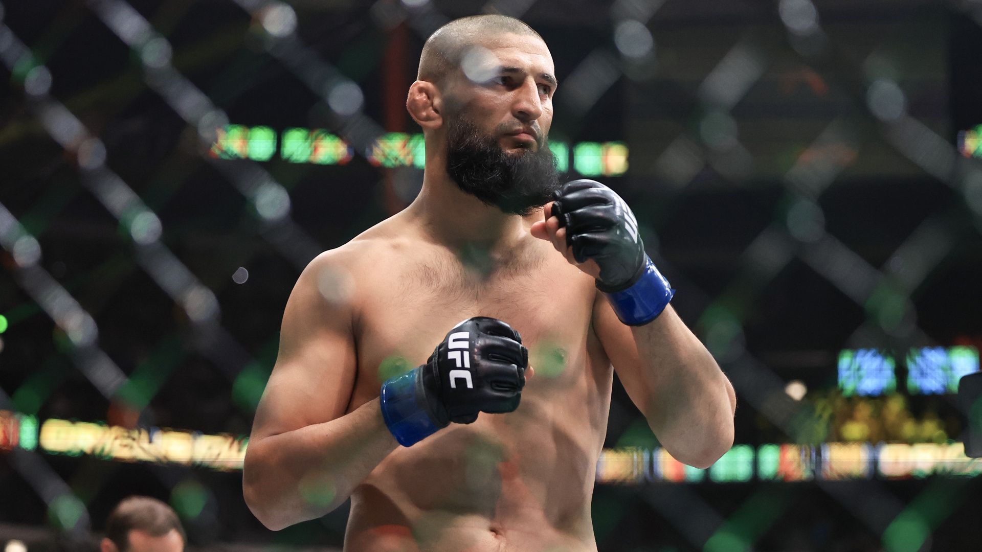 Khamzat Chimaev in the Octagon during a UFC bout.