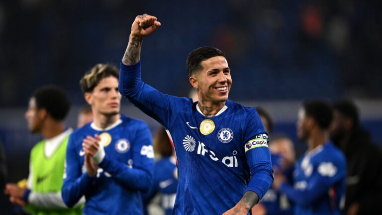 Enzo Fernandez of Chelsea celebrates at full-time following the team's victory in a Premier League soccer match.