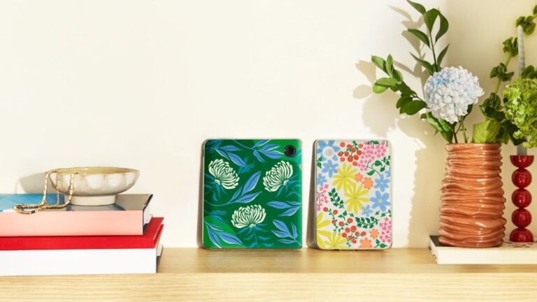 Colorful Kobo cases for the Libra Colour on a shelf with decorative items