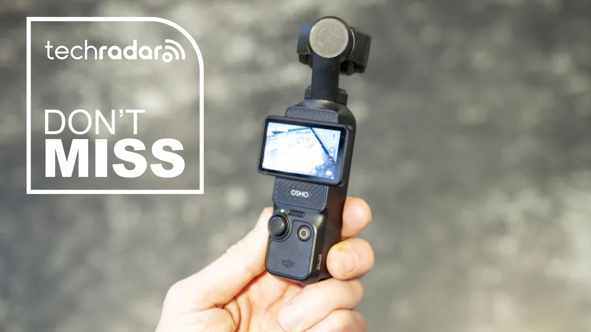 The DJI Osmo Pocket 3 during our testing, next to a white TechRadar badge that reads 'Don't Miss'