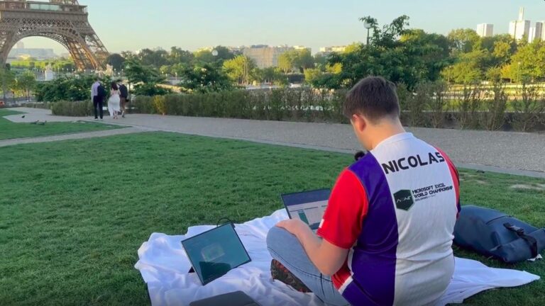 Nicolas Micot - Player 4 in the 2026 MEWC Landmark challenge, sat with a laptop in view of the Eiffel Tower