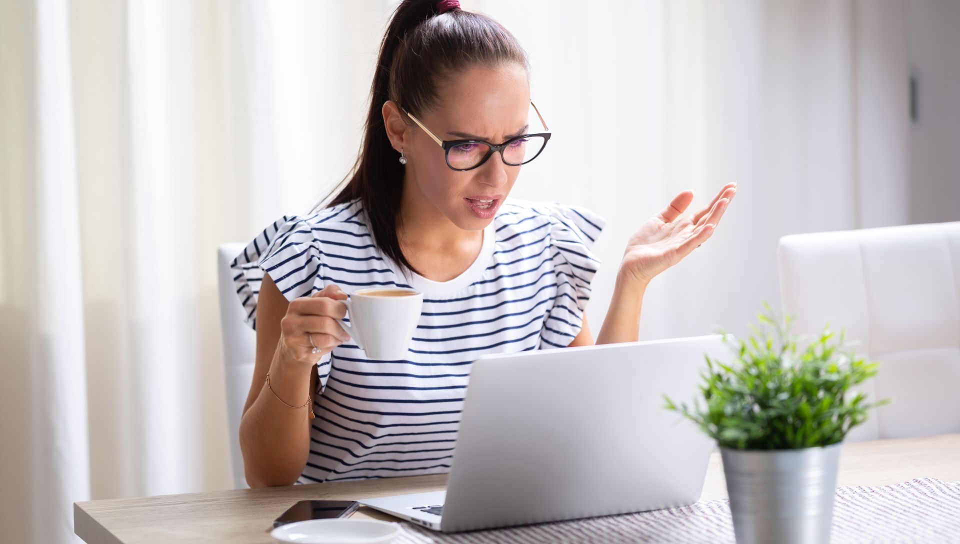 woman annoyed at laptop