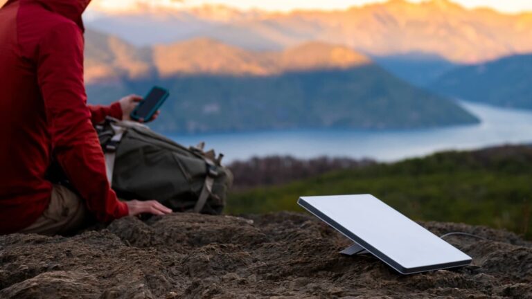 A Starlink Mini satellite dish in use in the mountains.