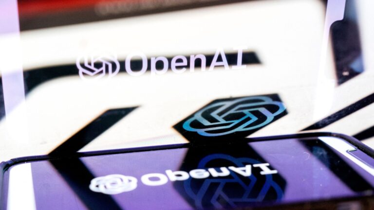 OpenAI logo on smartphone, reflected on main screen