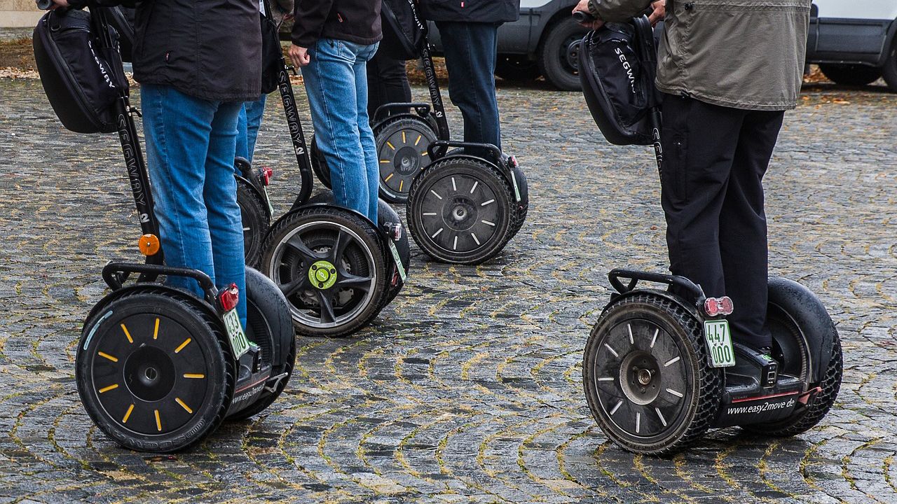 Image of people riding segways