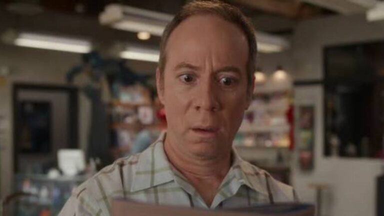 Stuart looks horrified at a piece of paper