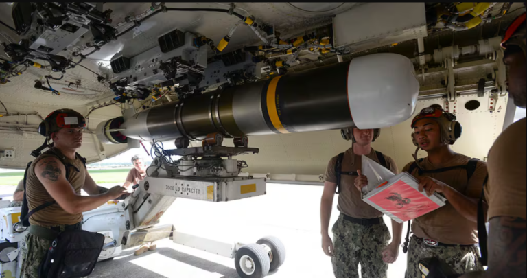 Aviation ordnancemen load a Mark 54 torpedo on a P-8A Poseidon aircraft during a proficiency exercise on Kadena Air Base, Okinawa, Japan.
