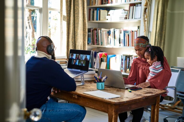 Family using laptops with EE Broadband