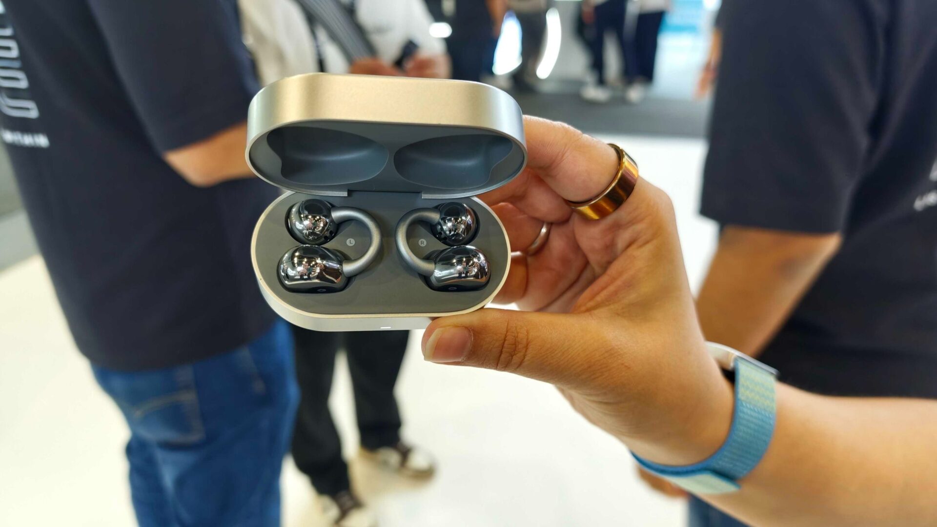 Noise Master Buds Open with Sound by Bose, held in a hand