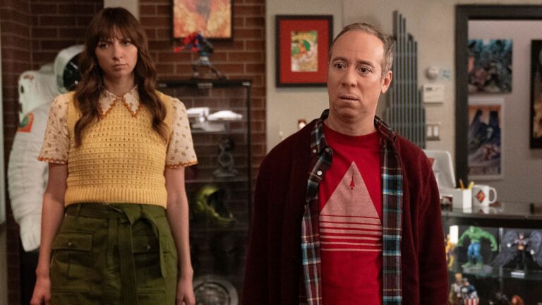 Stuart and Denise look at something offscreen