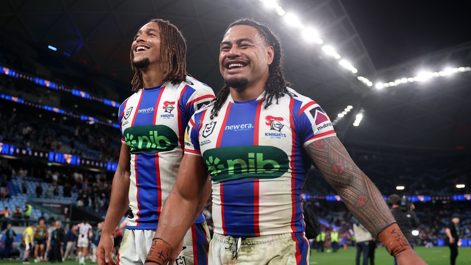 Dominic Young and Greg Marzhew of the Newcastle Knights celebrate a win during the 2026 NRL Finals.
