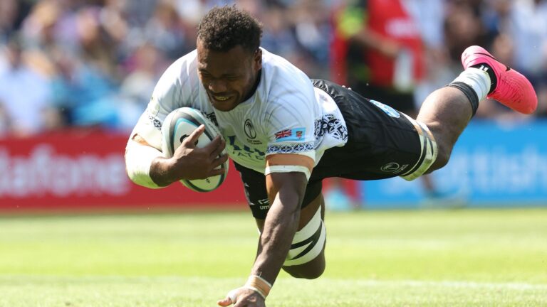 Elia Canakaivata of Fiji dives in to score a try.