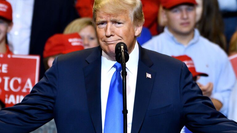 donald trump at trump rally smirking at camera