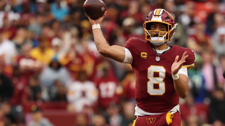 Marcus Mariota #8 of the Washington Commanders throws a pass during an NFL match in 2026.