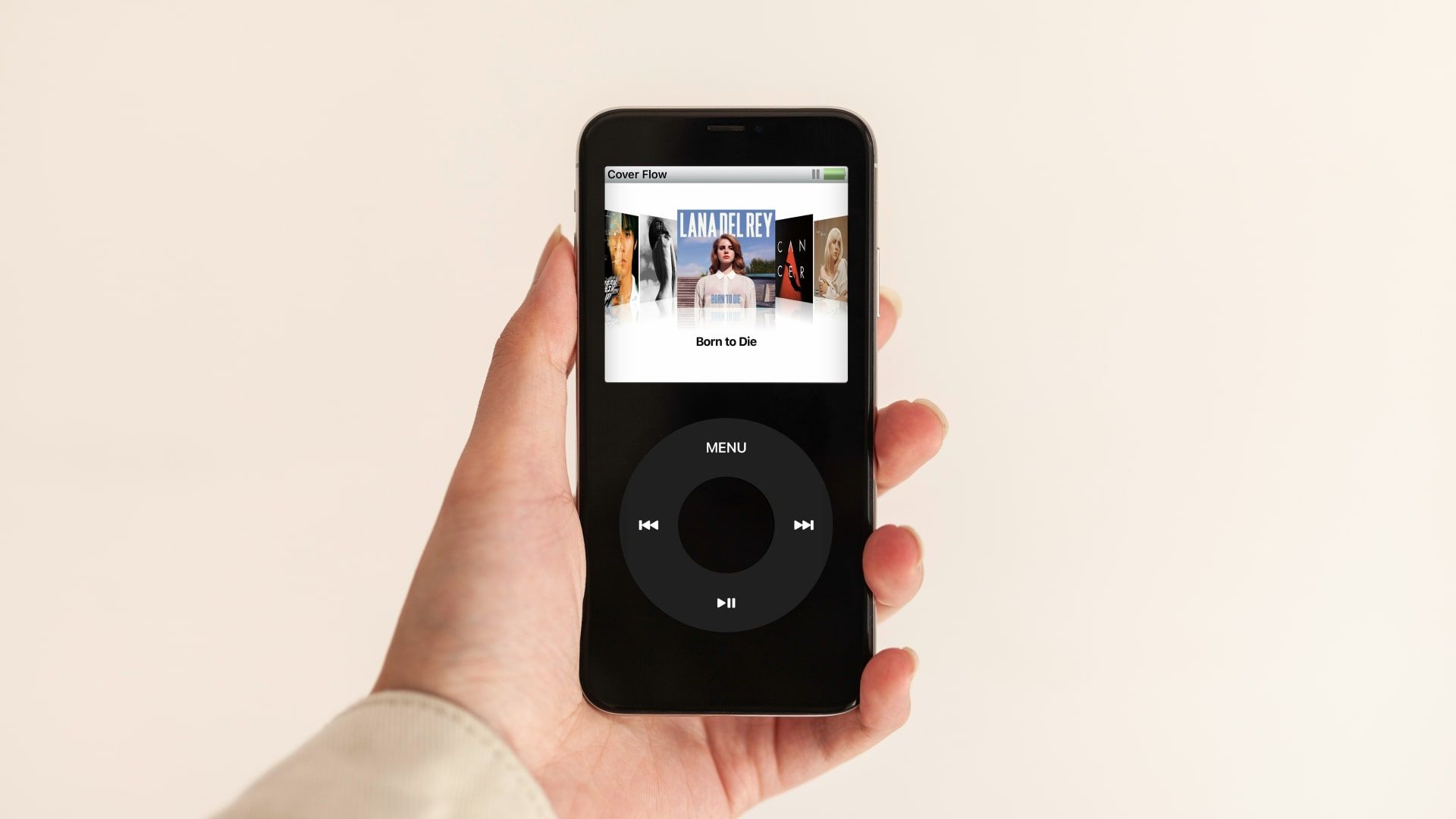 A person holding a black iPod.