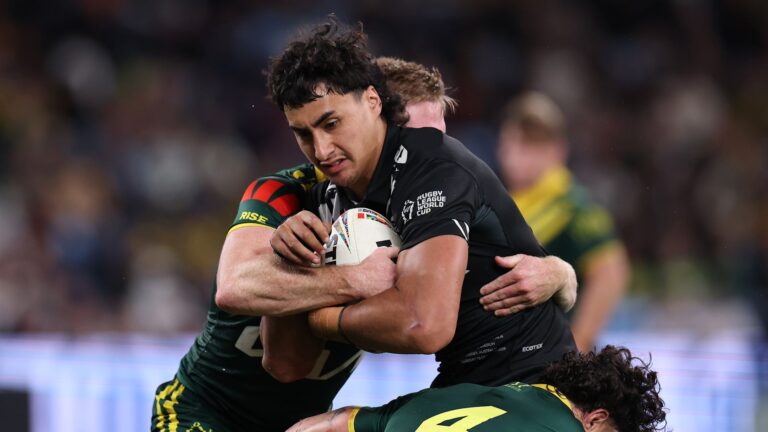 Casey McLean of New Zealand is tackled during a 2026 Men's Rugby League World Cup match.