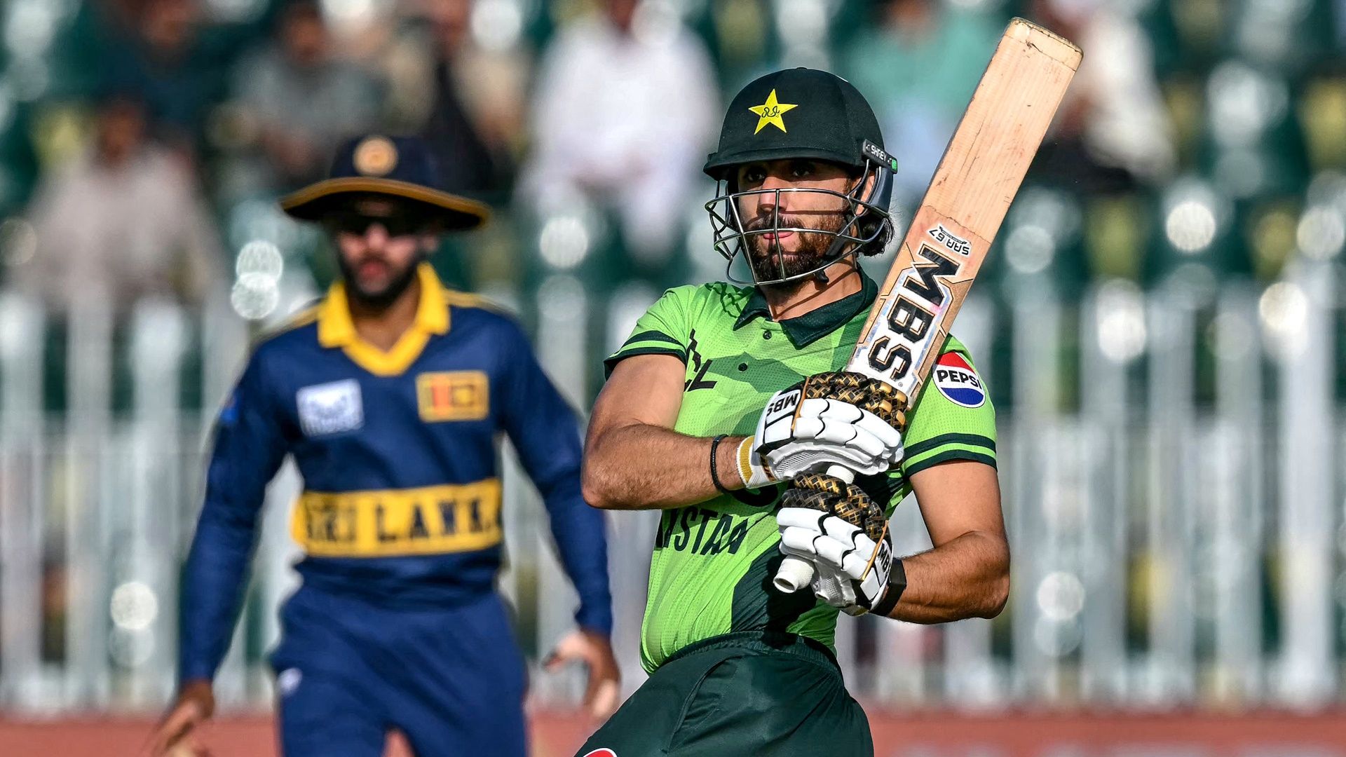 Pakistan's Salman Agha watches the ball after playing a shot during the tri-series one-day international (ODI) cricket match between Pakistan and Sri Lanka at the Rawalpindi Cricket Stadium.